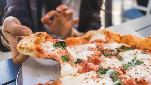 Delicious Italian pizza for lunch in the sun outside table in Napa California